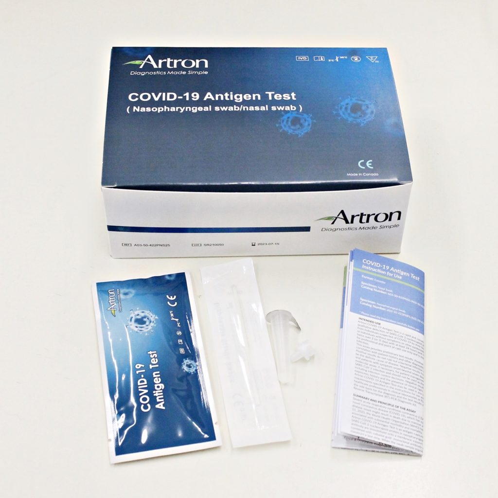 Rapid Antigen Test kit with white background. The Artron kit costs $58 for 5 tests/box. Approved by Health Canada for testing for COVID-19. COVID-19 rapid antigen test kit made by Artron. The kit includes a swab. The swab can be nasal or nasopharyngeal swab. Instructions are included in the kit.