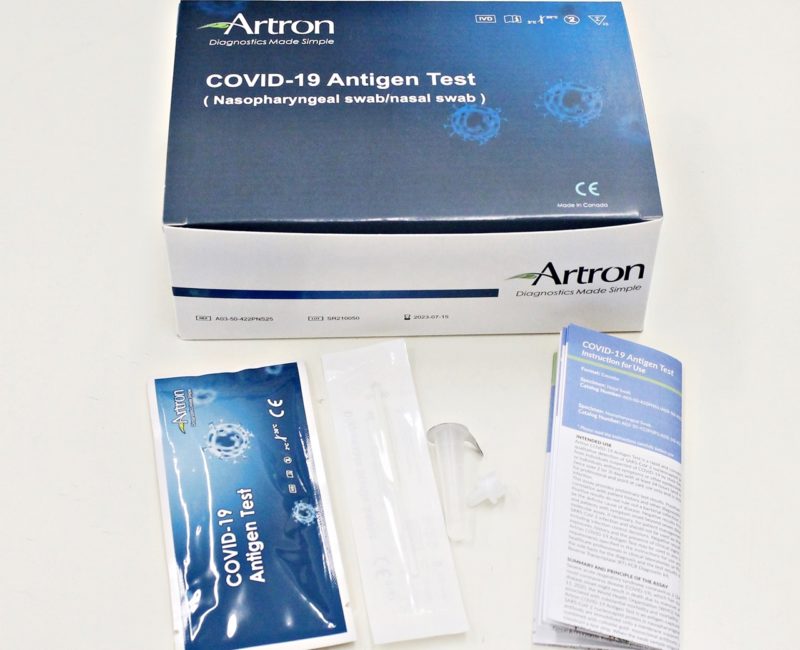 Rapid Antigen Test kit with white background. The Artron kit costs $58 for 5 tests/box. Approved by Health Canada for testing for COVID-19. COVID-19 rapid antigen test kit made by Artron. The kit includes a swab. The swab can be nasal or nasopharyngeal swab. Instructions are included in the kit.